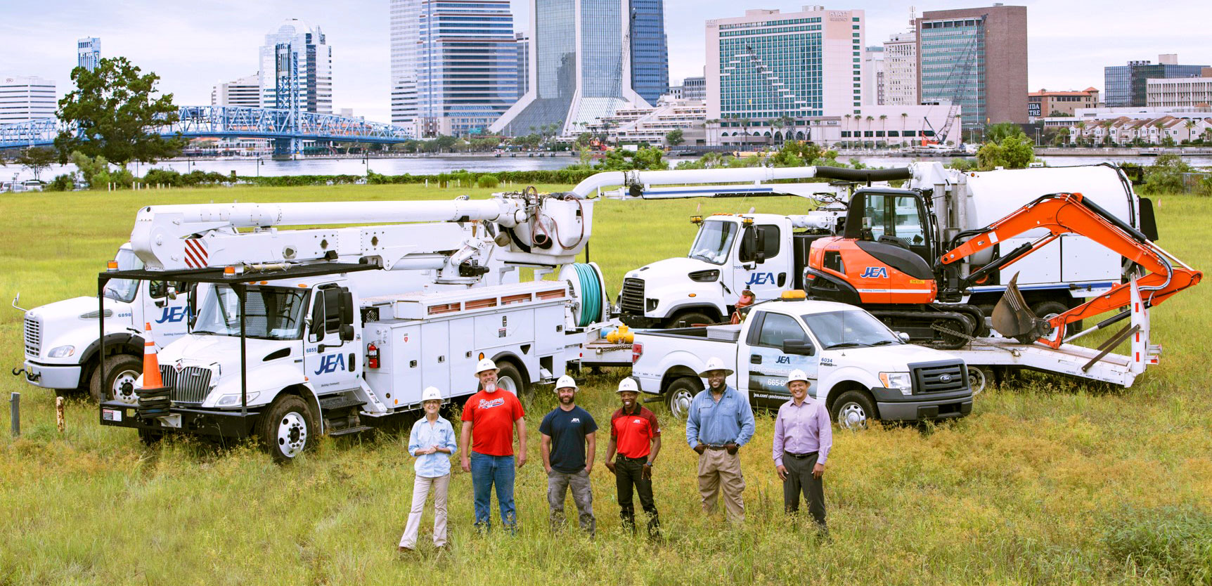 JEA Employees with JEA trucks on the river in Downtown Jacksonville
