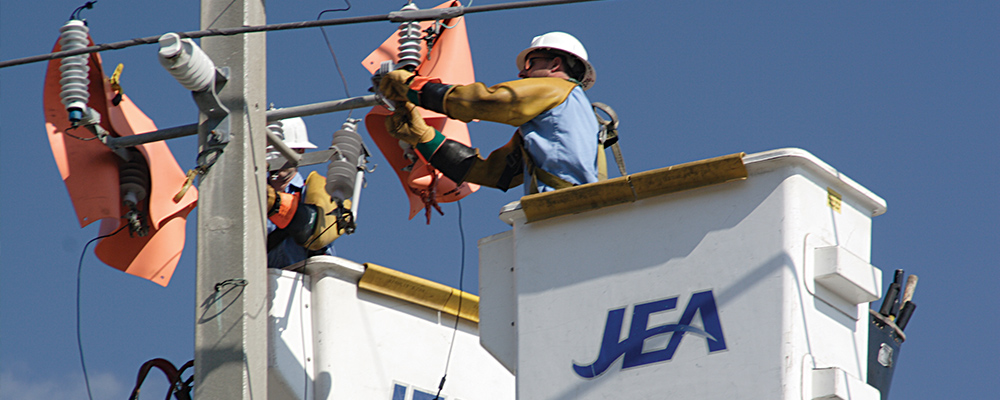 Linemen working on pole Linemen working on pole