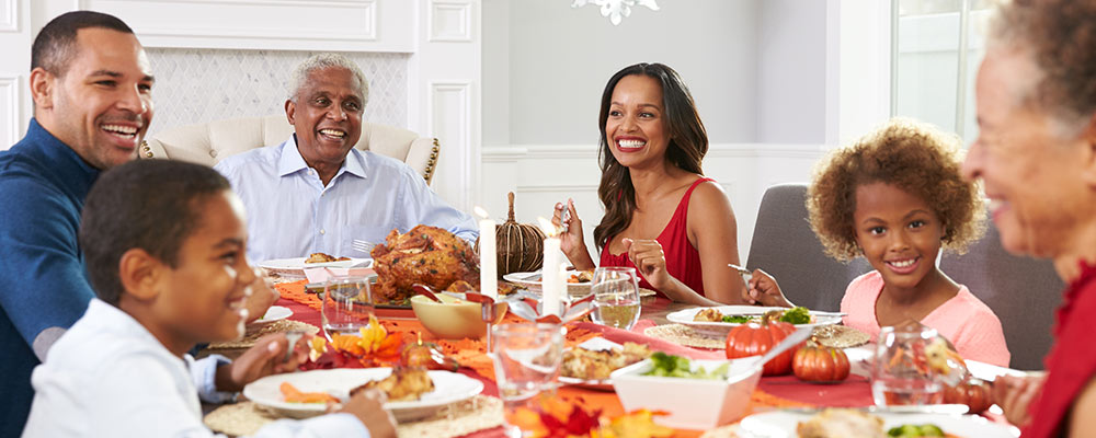 Family Having Dinner Laughing