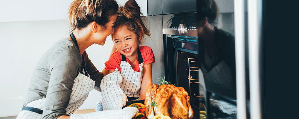 Mother and Daughter Cooking Turkey