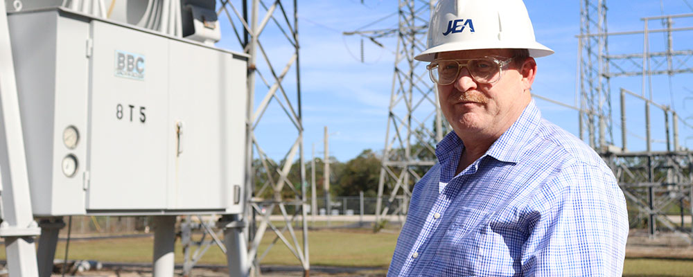 JEA Director of Asset Management, Andy, touring a substation facility. JEA Director of Asset Management, Andy, touring a substation facility