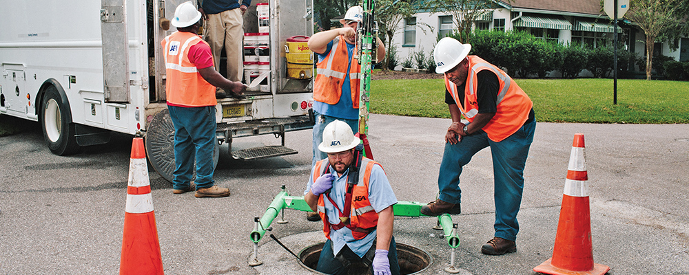 Men working in man hole Men working in man hole