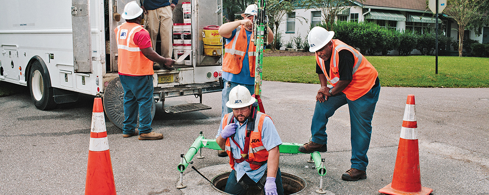 Men working in man hole