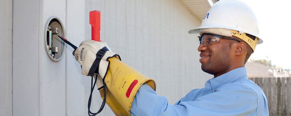 Employee checking a meter Employee checking a meter
