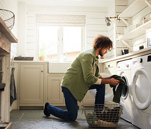 Man using washing machine