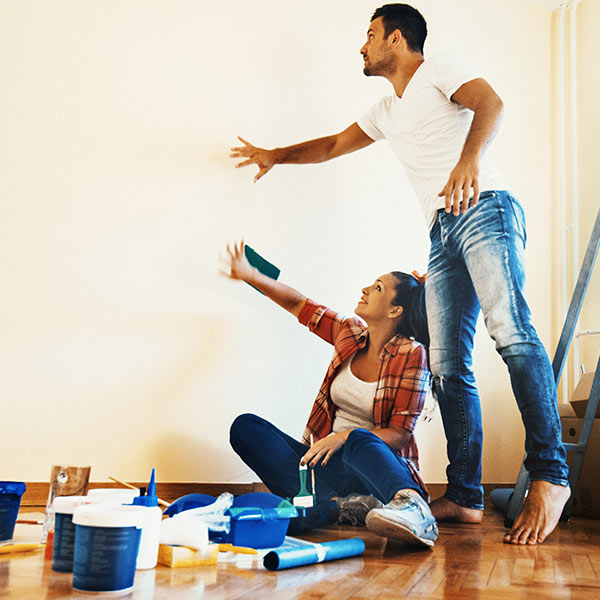 Couple Painting House